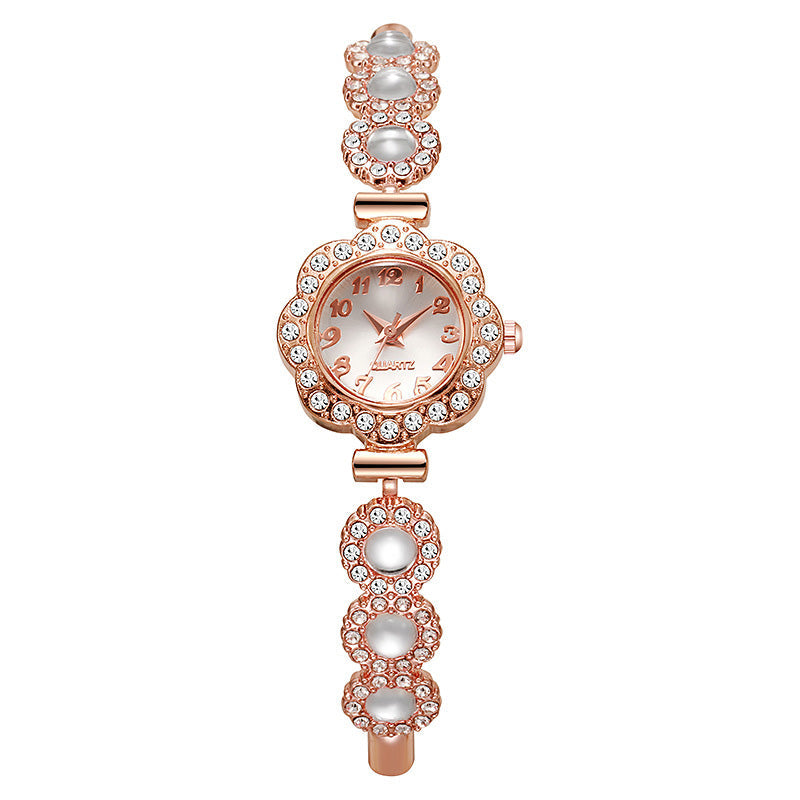 Elegante Damenuhr mit Strass-Blumen-Lünette