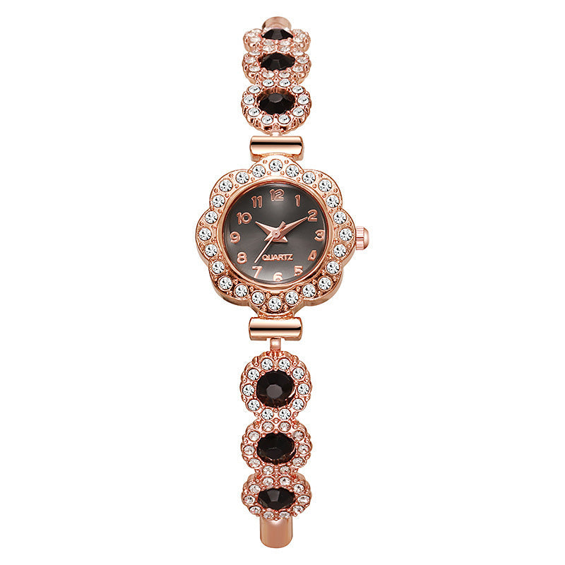 Elegante Damenuhr mit Strass-Blumen-Lünette